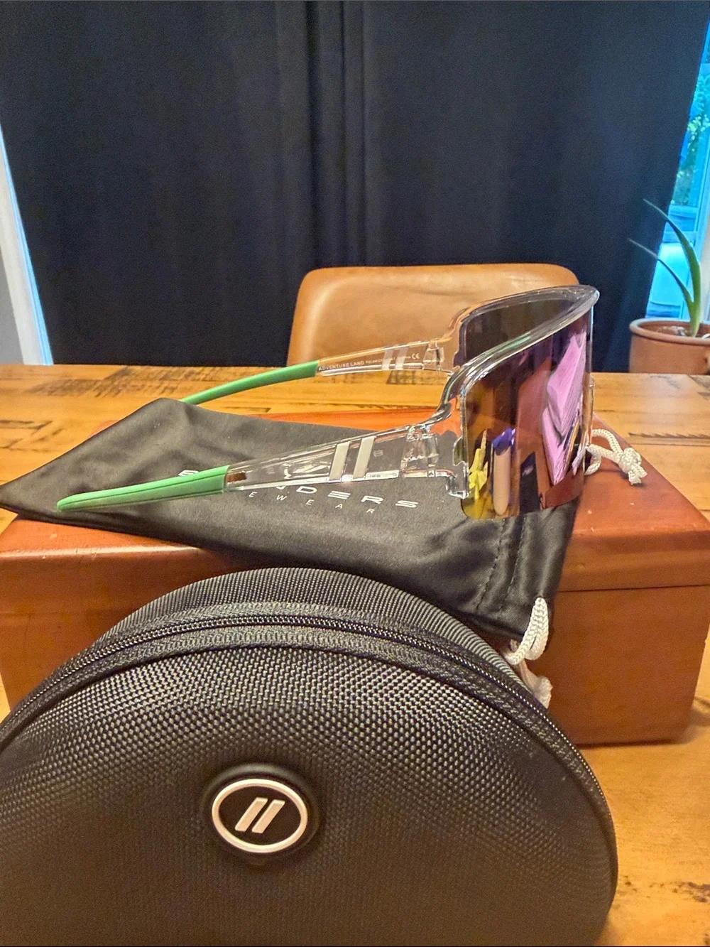 Blenders Polarized Sunglasses Purple iradescent lens with Green stems.